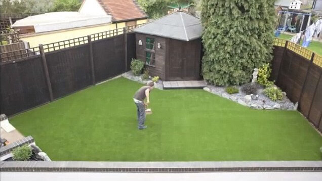 Man laying his own lawn